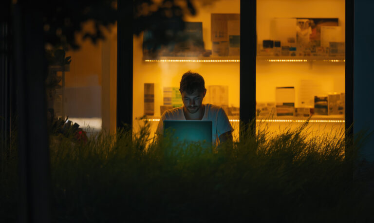 man working at night Represents the silent months before results arrive.